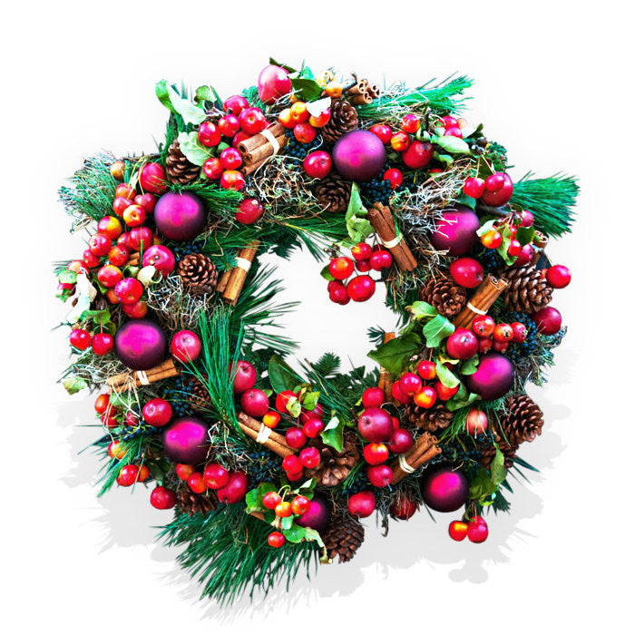 Christmas wreath with baubles and red apples