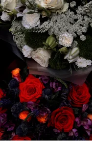 Red, purple, white and green funeral flowers