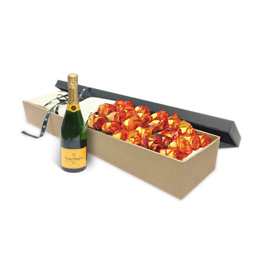 A box of luxury orange roses and a bottle of Veuve Cliquot champagne