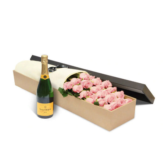 A box of luxury Ecuadorian long-stemmed pink roses with a bottle of Veuve Clicquot champagne