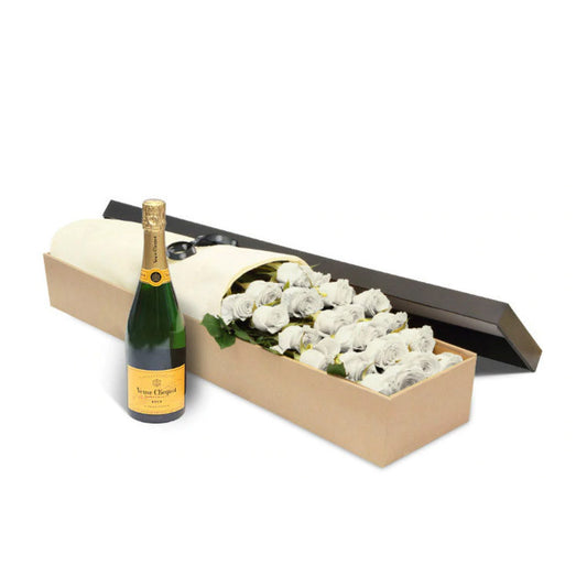 A box of luxury Ecuadorian long-stemmed white roses with a bottle of Veuve Cliquot